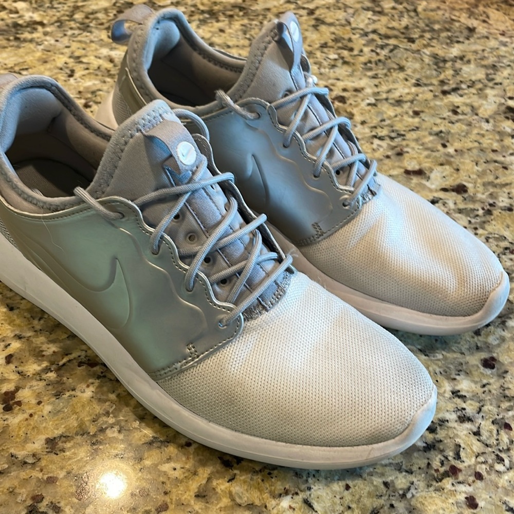Nike Roshe ones. Silver and white